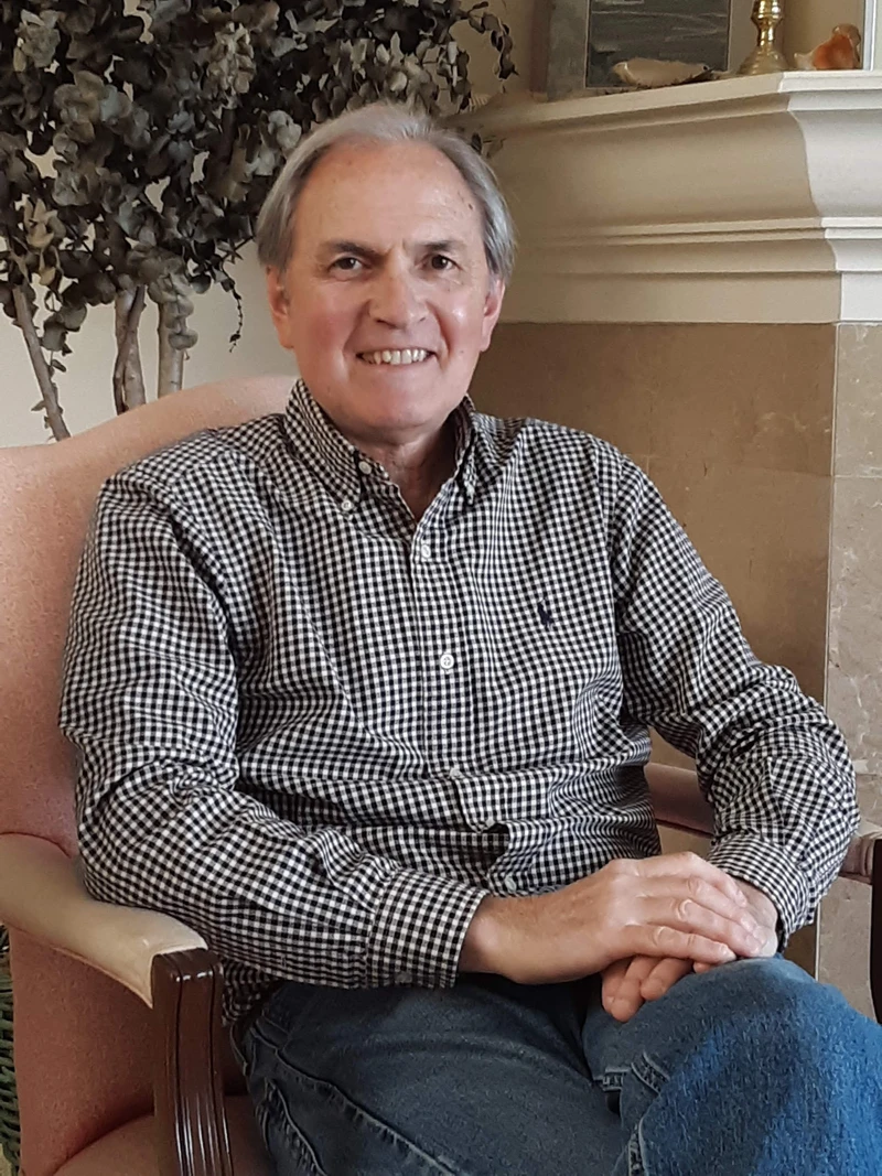 Gallery architect, Joseph Nucazzo, sitting in a chair